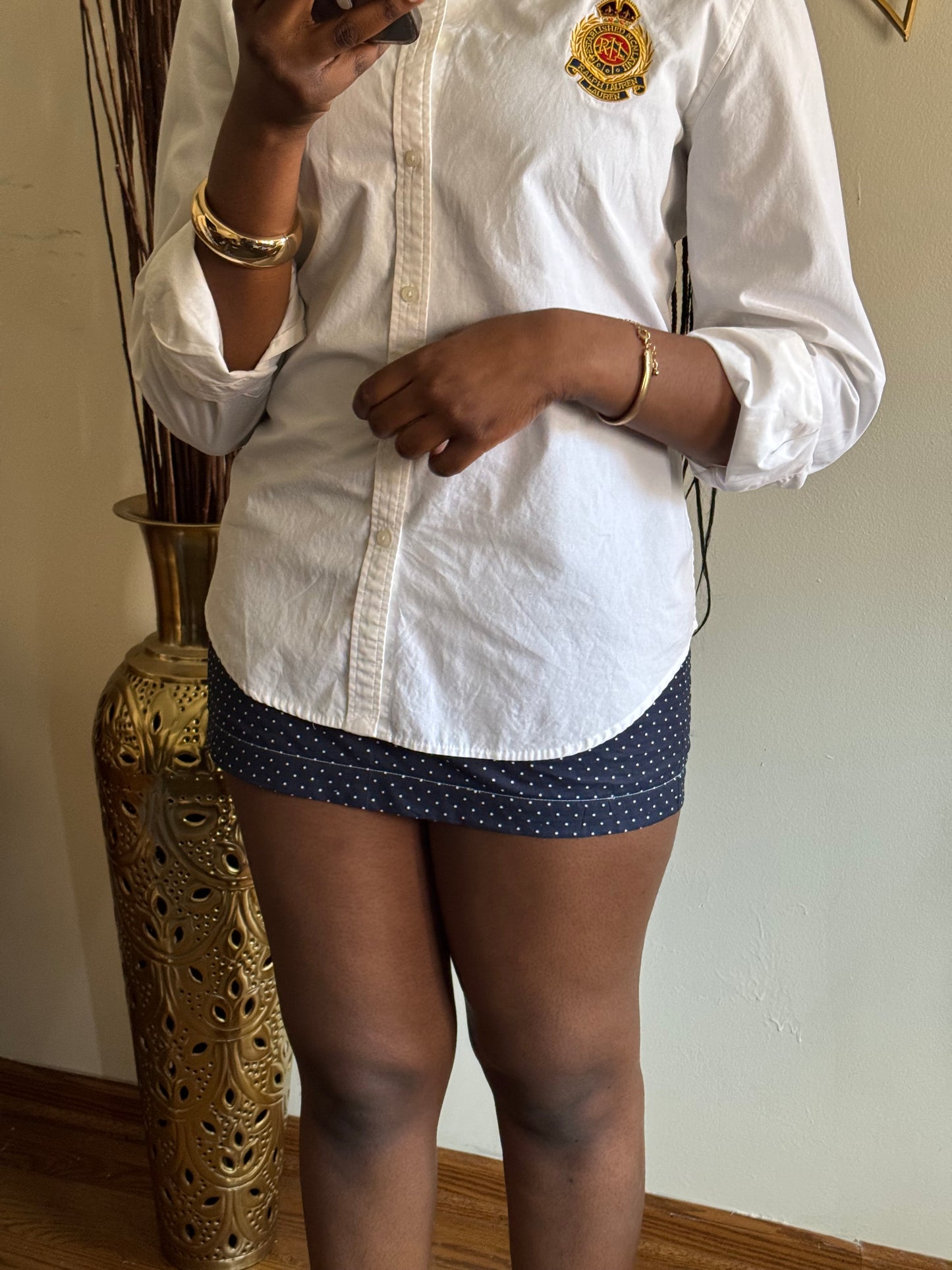 Polka dot skirt with tailored waist and vintage elegance, perfect for slow summer fashion.