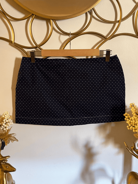 Navy blue cotton mini skirt with ivory polka dots by Lola’s Digicam, styled for city nights and rooftop dates.
