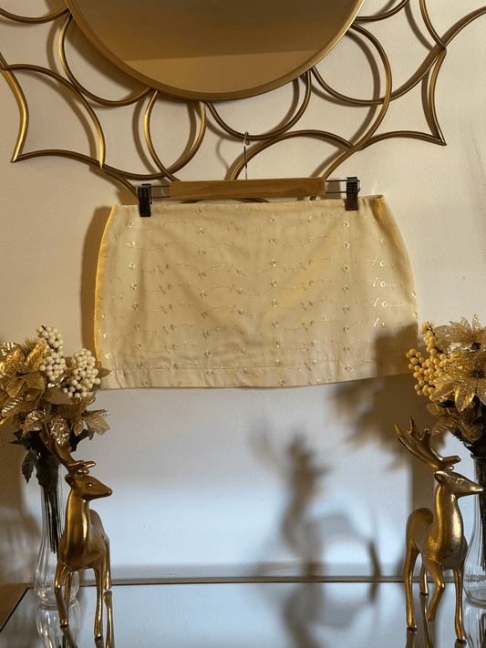 Yellow floral embroidered mini skirt by Lola’s Digicam, designed for golden hour dressing and summer events.