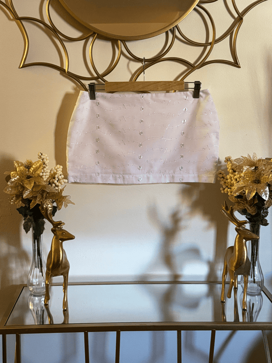 White eyelet mini skirt styled for romantic travel and golden hour by Lola’s Digicam.