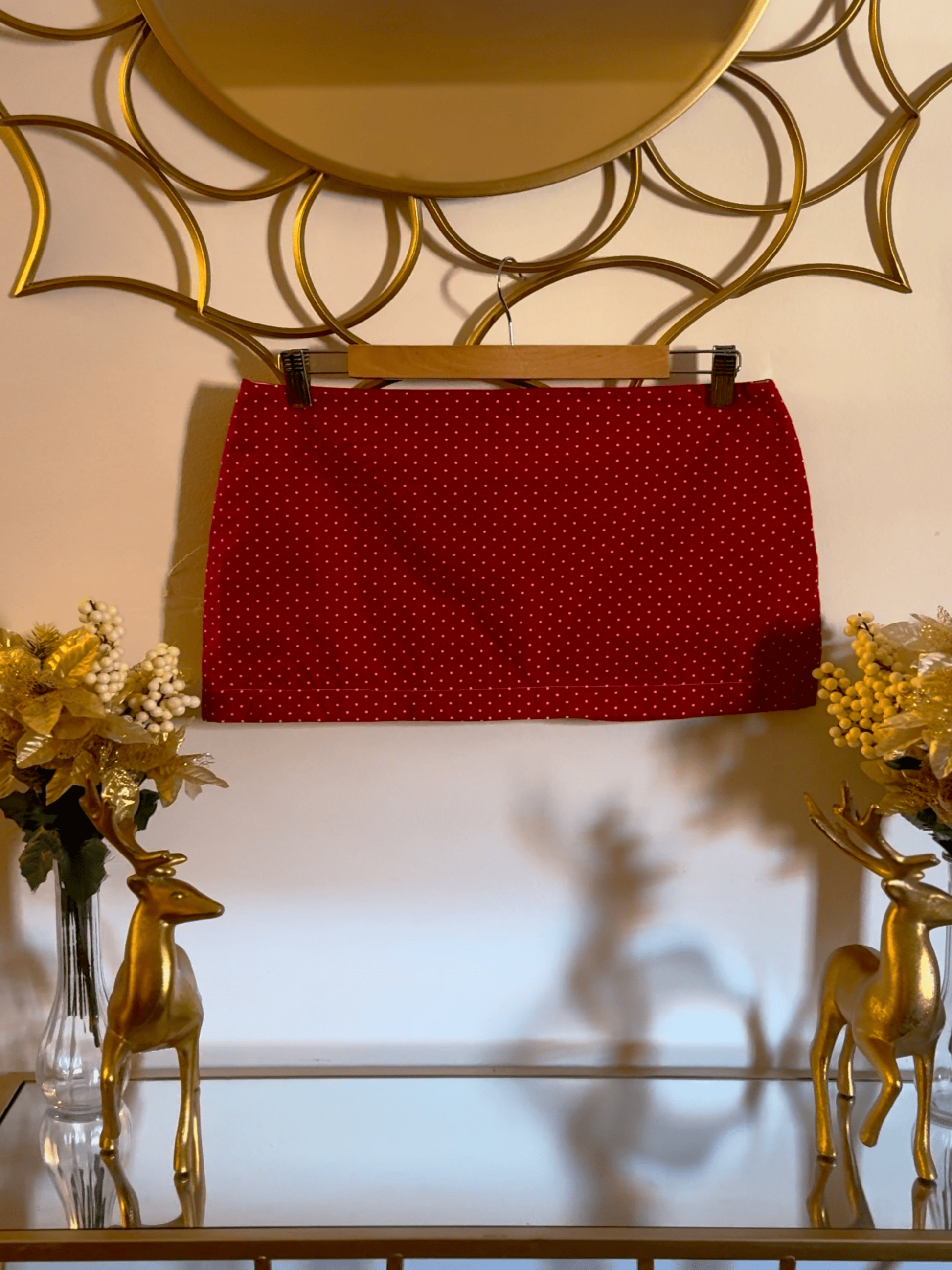 Red cotton mini skirt with cherry-red polka dots by Lola’s Digicam, styled for statement summer looks.