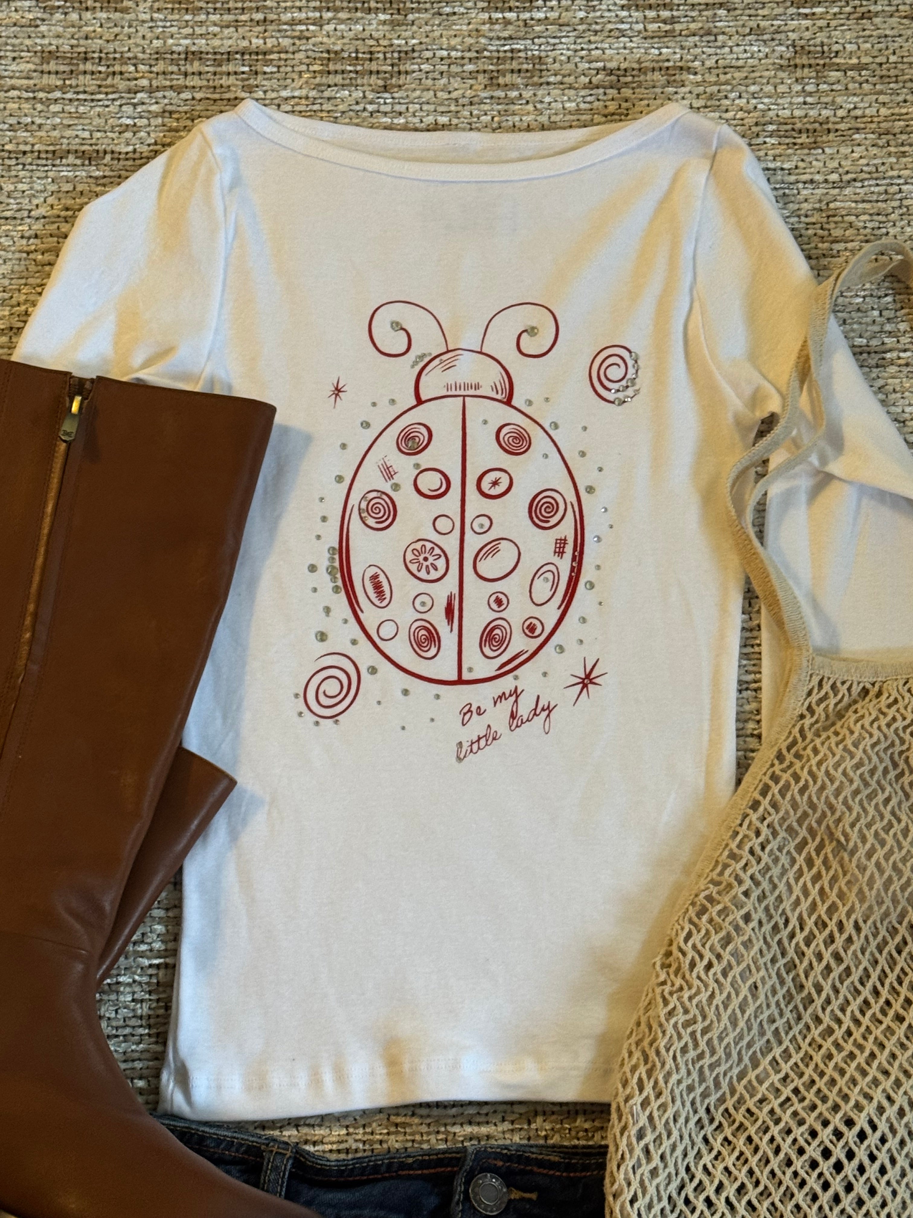 “Be My Little Lady” White Rhinestone Ladybug Boat Neck Top