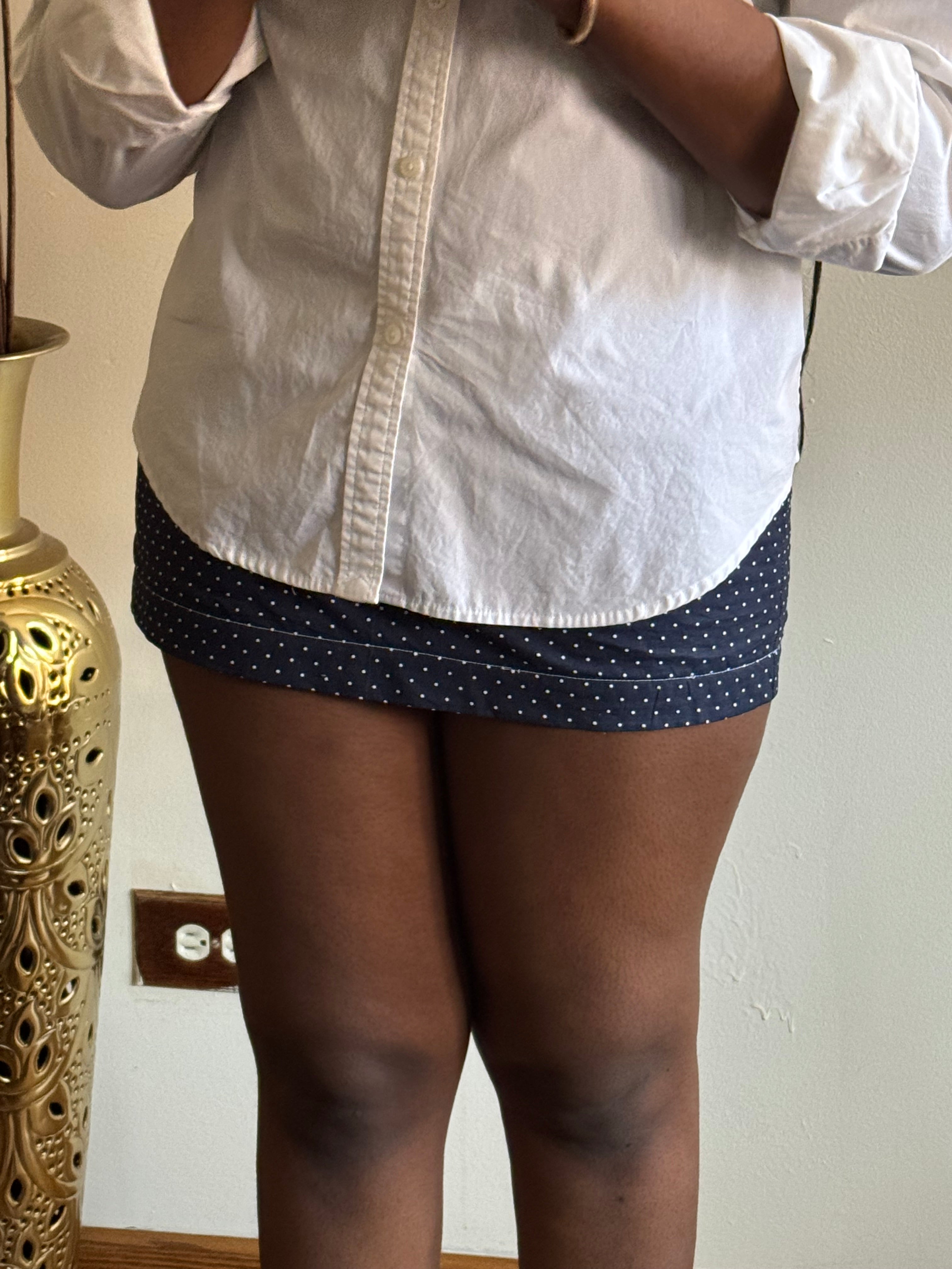 Polka dot skirt with tailored waist and vintage elegance, perfect for slow summer fashion.