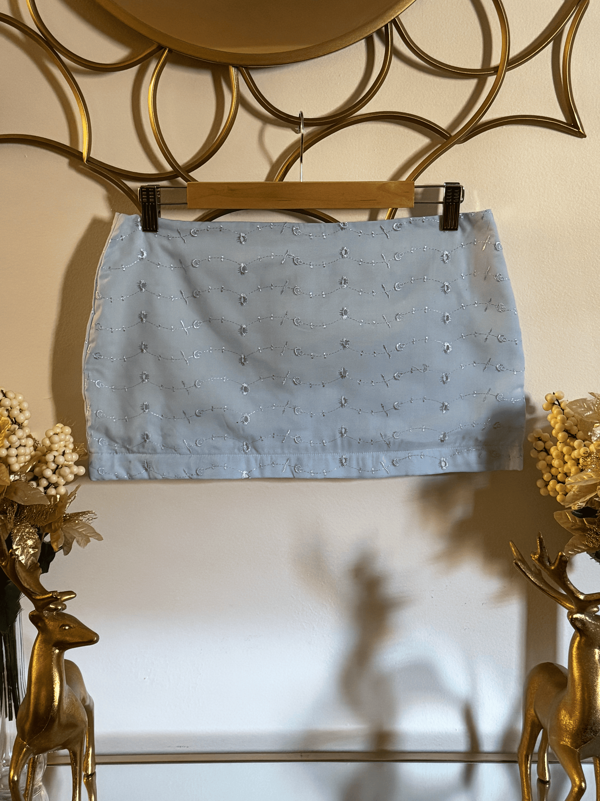 Sky blue eyelet mini skirt from Lola’s Digicam, worn for vacation styling and summer getaways.