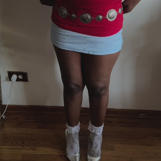 On-Body Delicate floral embroidery on the Celeste Skirt, crafted for soft, romantic summer fashion.